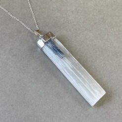 selenite with kyanite pendant piece capped